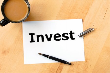 simsearch:400-09011393,k - investment business concept with pen paper and cup of coffee Photographie de stock - Aubaine LD & Abonnement, Code: 400-05334096