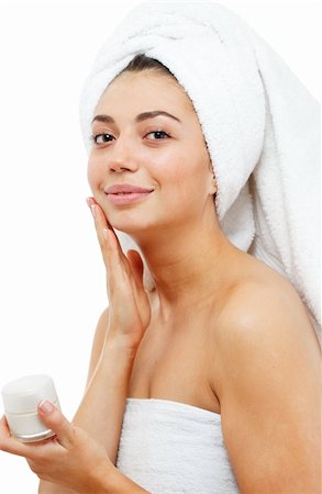 simsearch:400-04377849,k - Beautiful women applying moisturizer cosmetic cream on face. Isolated over white. Foto de stock - Super Valor sin royalties y Suscripción, Código: 400-05334361