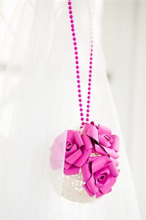 Bridal decoration of white sphere of bars with pink paper flowers and pink beads Fotografie stock - Microstock e Abbonamento, Codice: 400-05334497