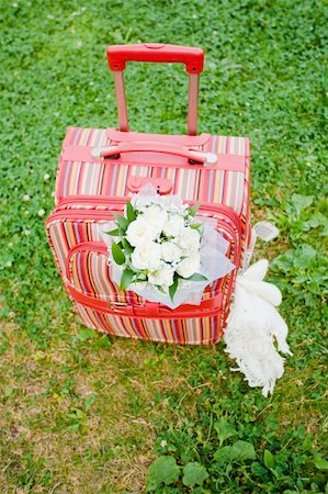 Packed suitcase with bridal bouquet and white planket is ready for honeymoon Fotografie stock - Microstock e Abbonamento, Codice: 400-05334565