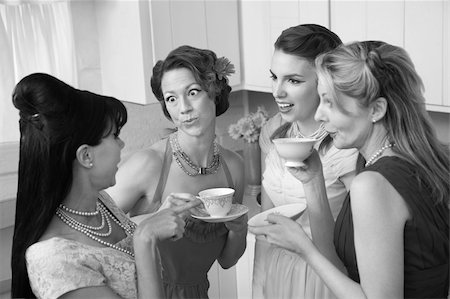 foursome - Four retro-styled women chit-chat over coffee in a kitchen Stock Photo - Budget Royalty-Free & Subscription, Code: 400-05334597