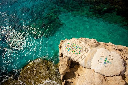 simsearch:400-05052257,k - Marked jumping point on the rock coast over clear sea in Cyprus Stock Photo - Budget Royalty-Free & Subscription, Code: 400-05334605