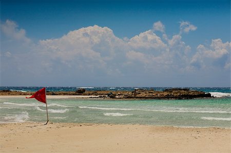 Waving in the wind red flag titled "Danger for swimming" Fotografie stock - Microstock e Abbonamento, Codice: 400-05334618