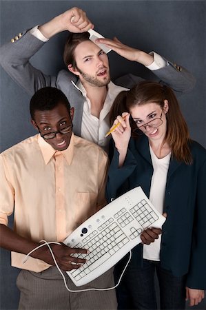 simsearch:400-04382028,k - Geeks with keyboard, salesman comb and pencil making faces Photographie de stock - Aubaine LD & Abonnement, Code: 400-05334917