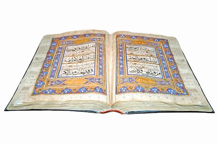 Holy Islamic old book Koran opened and isolated Stock Photo - Budget Royalty-Free & Subscription, Code: 400-05334978