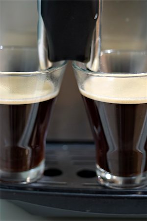 Two crystal cups filled by a espresso machine. Fotografie stock - Microstock e Abbonamento, Codice: 400-05335582