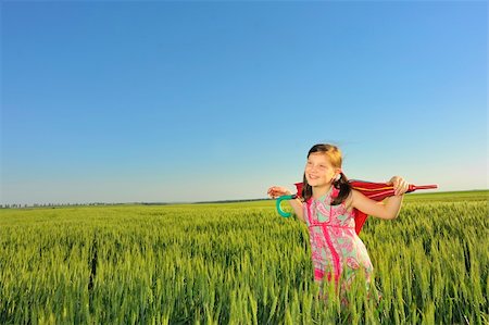 red lifestyle spring - a little girl with a umbrella Stock Photo - Budget Royalty-Free & Subscription, Code: 400-05335672