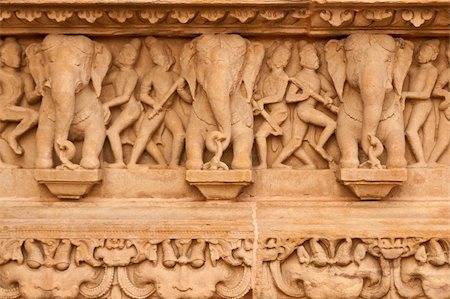 elephant with temple - Carved elephants decorating the ancient Lakshmana Hindu Temple at Khajuraho, India. 10th Century AD. Stock Photo - Budget Royalty-Free & Subscription, Code: 400-05335752