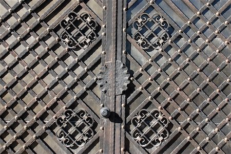 Door-handle decoration detail of old metal iron entrance door in Prague Little quarter Stock Photo - Budget Royalty-Free & Subscription, Code: 400-05335845