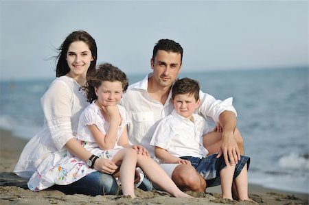 happy young family have fun and live healthy lifestyle on beach Stock Photo - Budget Royalty-Free & Subscription, Code: 400-05336152