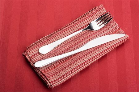 elegant dining service - Knife and fork on a napkin as a dining room serving. Stock Photo - Budget Royalty-Free & Subscription, Code: 400-05336865