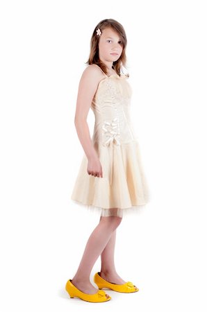 Teenager girl in mother's dress and shoes isolated on white Stock Photo - Budget Royalty-Free & Subscription, Code: 400-05336873