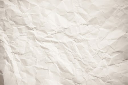 sheet of paper wrinkled - A plain wrinkled white paper, sepia. Stock Photo - Budget Royalty-Free & Subscription, Code: 400-05337422