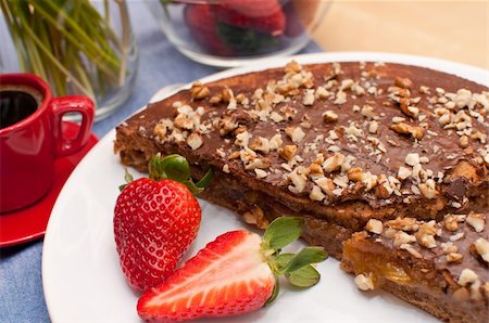 Walnut Cake With Strawberries and Cup of Coffee on Table Photographie de stock - Aubaine LD & Abonnement, Code: 400-05338108