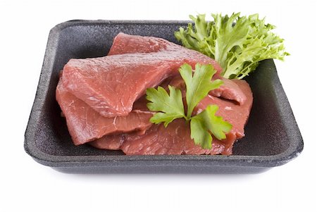 Raw beef frying steak in black tray  isolated over white background Stock Photo - Budget Royalty-Free & Subscription, Code: 400-05338212