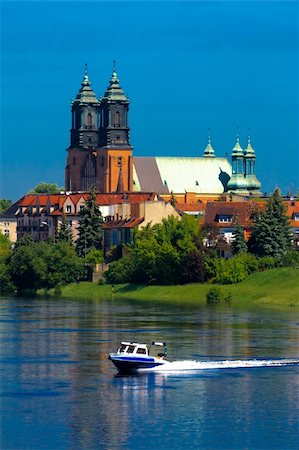 Cathedral church and motorboat at the river in the center of city Stock Photo - Budget Royalty-Free & Subscription, Code: 400-05338296