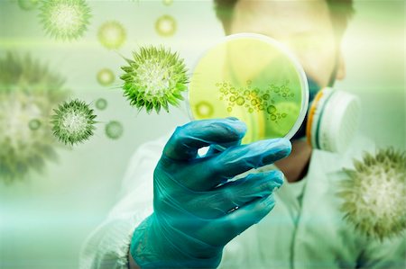 A scientist holding a Petri Dish with Virus and bacteria cells. Foto de stock - Super Valor sin royalties y Suscripción, Código: 400-05338775