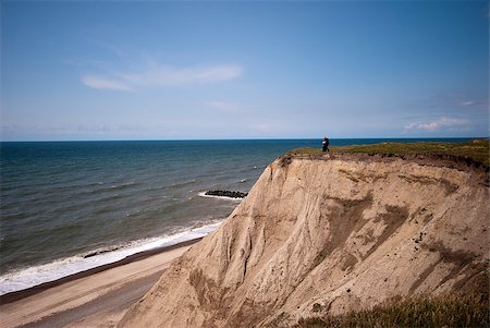 Cliff erosion at the Danish coastline close to Bovbjerg Lighthouse and the North Sea. Stock Photo - Budget Royalty-Free & Subscription, Code: 400-05339305