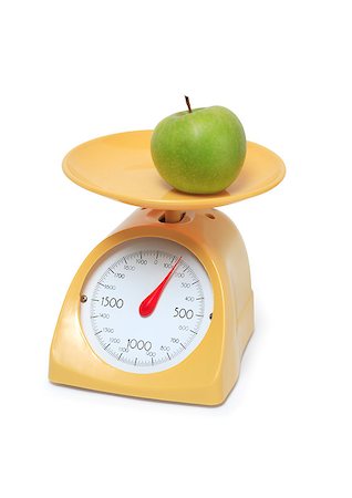 scales market fruits - Green apple lying on yellow kitchen scale. Isolated on white background with clipping path Stock Photo - Budget Royalty-Free & Subscription, Code: 400-05339470