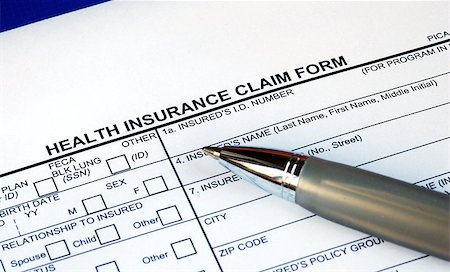 Filling the health insurance claim form isolated in blue Stock Photo - Budget Royalty-Free & Subscription, Code: 400-05339533