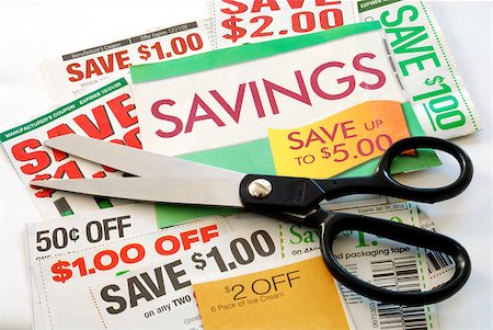 Cut up some coupons to save money Foto de stock - Super Valor sin royalties y Suscripción, Código: 400-05339545