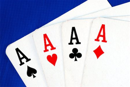 simsearch:400-07314049,k - Four ace play cards isolated on blue Photographie de stock - Aubaine LD & Abonnement, Code: 400-05339692