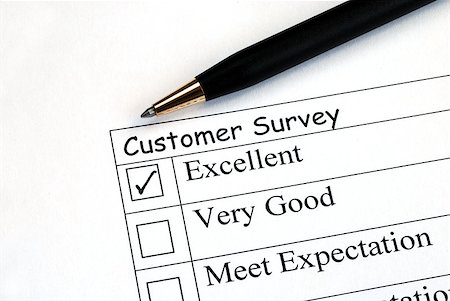 Customer fills in the feedback survey Stock Photo - Budget Royalty-Free & Subscription, Code: 400-05339806