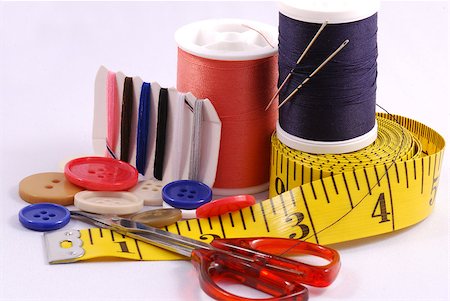 sewing tools - Some sewing tools such as threads, needles, buttons, and scissors Stock Photo - Budget Royalty-Free & Subscription, Code: 400-05339854