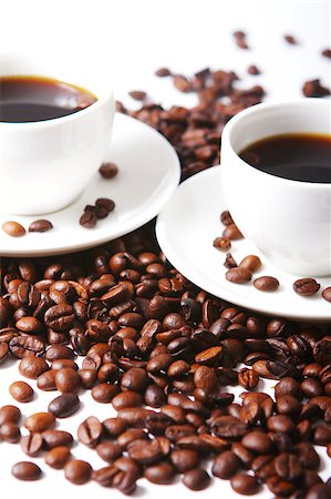 Coffee beans with white cups on the table Stock Photo - Budget Royalty-Free & Subscription, Code: 400-05339906