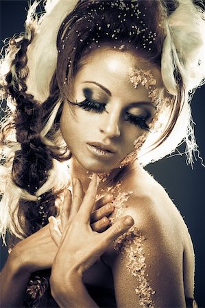 Vogue style portrait of a woman with gold-silver bodyart and makeup Stock Photo - Budget Royalty-Free & Subscription, Code: 400-05330695