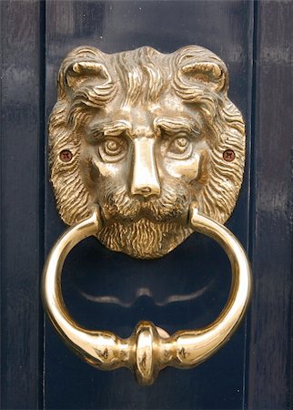 door lion - Antique golden lion door knocker with blue background Stock Photo - Budget Royalty-Free & Subscription, Code: 400-05331440