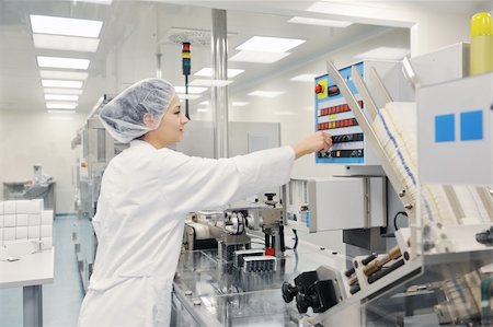 pill production - woman worker in pharmacy company warehouse Stock Photo - Budget Royalty-Free & Subscription, Code: 400-05331644