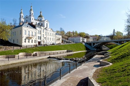 Belarus nice Vitebsk spring landscape view of St. Uspenski Cathedral over Vitba river with little waterflow Stockbilder - Microstock & Abonnement, Bildnummer: 400-05331652