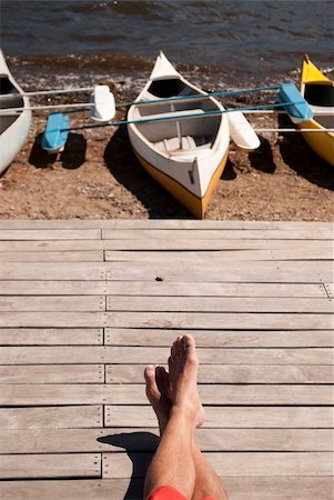 dock on a lake summer feet - Resting on the pier Stock Photo - Budget Royalty-Free & Subscription, Code: 400-05331727