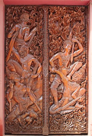 Buddhist temple door decoration in Paksong City, Champasak Province, Southern of Laos Stock Photo - Budget Royalty-Free & Subscription, Code: 400-05331872