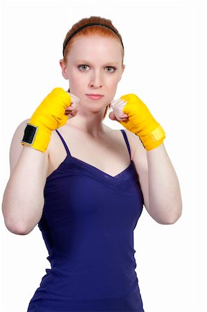 A beautiful young woman wearing a pair of boxing gloves Stock Photo - Budget Royalty-Free & Subscription, Code: 400-05331885