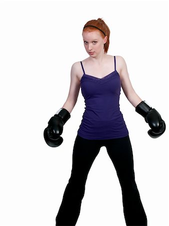 A beautiful young woman wearing a pair of boxing gloves Stock Photo - Budget Royalty-Free & Subscription, Code: 400-05331886