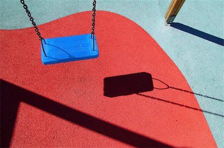 blue park swing or red floor children playground with shadows Stock Photo - Budget Royalty-Free & Subscription, Code: 400-05332000