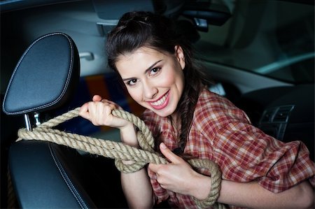 Young woman with rope inside New car with leather interior Stock Photo - Budget Royalty-Free & Subscription, Code: 400-05332305