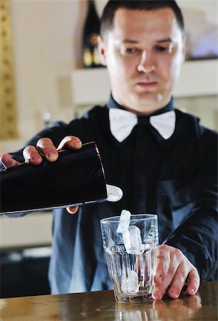 pro barman prepare coctail drink and representing nightlife and party event  concept Stock Photo - Budget Royalty-Free & Subscription, Code: 400-05332558