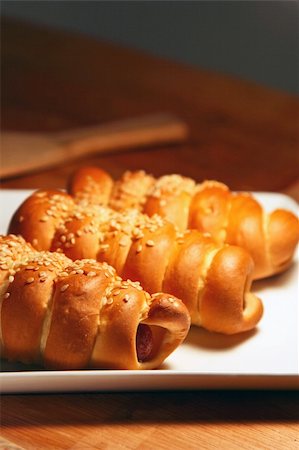 egypix (artist) - fresh baked pastry with sausage and sesame Stockbilder - Microstock & Abonnement, Bildnummer: 400-05332647