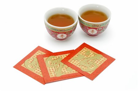 Chinese longevity tea cups and red packets for tea ceremony on white background Stock Photo - Budget Royalty-Free & Subscription, Code: 400-05332898