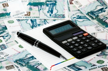 simsearch:400-04894431,k - Calculator notebook and pen on a background the Russian roubles. Stock Photo - Budget Royalty-Free & Subscription, Code: 400-05333156