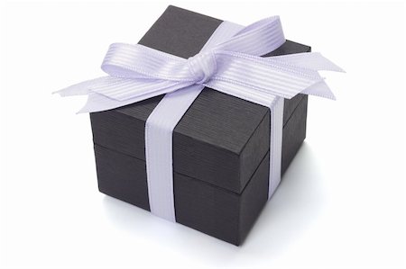 Black gift box with bow ribbon on white backgropund Stock Photo - Budget Royalty-Free & Subscription, Code: 400-05333228