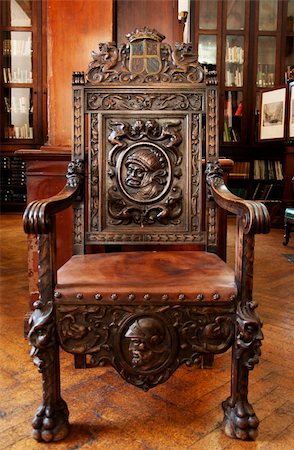 This antique wooden chair sits in the grand Garrison Library in Gibraltar. Fotografie stock - Microstock e Abbonamento, Codice: 400-05333375