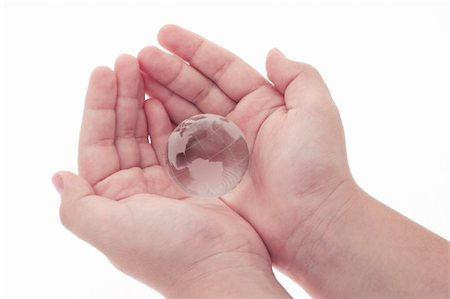 simsearch:400-04865676,k - Young boy holding crystal globe in open palms on white background Fotografie stock - Microstock e Abbonamento, Codice: 400-05333397