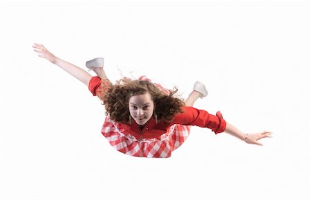 schweben - levitation - youth girl flying in studio isolated over white Stockbilder - Microstock & Abonnement, Bildnummer: 400-05333481