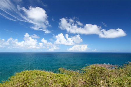 simsearch:700-02903732,k - Wispy clouds form off the coast on the Caribbean island of Saint Kitts. Stockbilder - Microstock & Abonnement, Bildnummer: 400-05333709