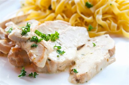 close-up of plate of pasta and chicken with lettuce Stock Photo - Budget Royalty-Free & Subscription, Code: 400-05333953