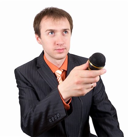 The young man with a microphone interviews Foto de stock - Super Valor sin royalties y Suscripción, Código: 400-05333978